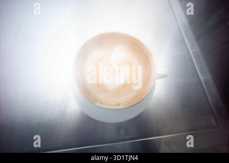 coffee cup, on steel table, café, Blurred, abstract view ,generic coffee cup, Stock Photo