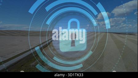 Displaying central padlock icon securing rural farmland via digital interface, binary code overlay Stock Photo