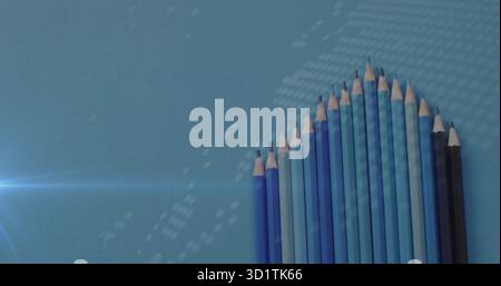 Showcasing fifteen blue-shaded pencils ascending on blue tabletop, with lens flare, copy space Stock Photo
