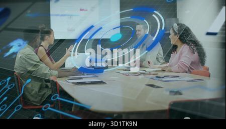 Collaborating four professionals in suits analyzing data in meeting room with laptops, hologram Stock Photo