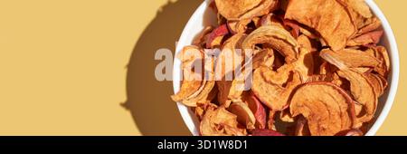 Crispy dried food. Organic tasty chips. Homemade snacks. Sliced apples Stock Photo