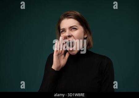 Woman Making Face With Mouth Open Stock Photo