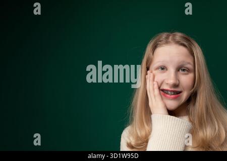 Woman With Long Blonde Hair Posing for a Picture Stock Photo