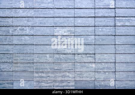 Blue grey rectangular slate plates as wall cladding Stock Photo