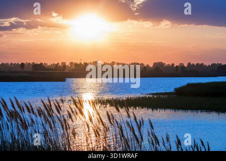 Sunset Scene over Lake, Water Surface Sunset Stock Photo