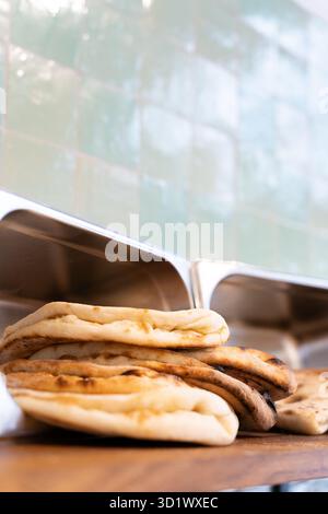 Fresh Naan Bread Stack in Restaurant Kitchen Stock Photo