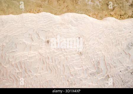 Abstract textures of the travertine terraces in Pamukkale, Türkiye (Turkey), formed by mineral-rich thermal waters. Stock Photo