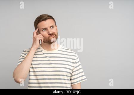 Thoughtful middle-aged man solving problem, planning, thinking of solution, decision, creative idea Stock Photo