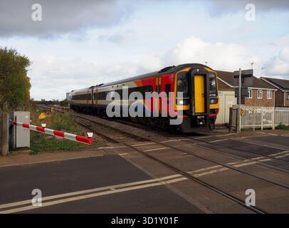 East Midlands Railway Class 158 Sprinter 158788 at Queen Adelaide Level Crossing, Ely, Cambridgeshire, UK Stock Photo