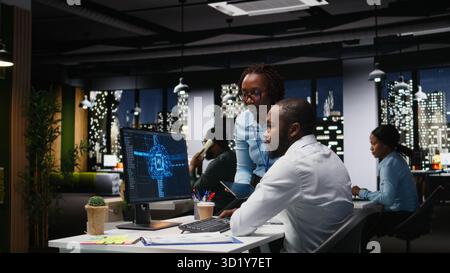Business team of experts use AI big data and predictive analytics, checking smart work solutions and cloud computing for adaptive strategies. Artificial intelligence engineering algorithms. Stock Photo