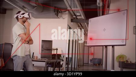 Using vr headset, man wearing green polo shirt standing thoughtfully in open office, copy space Stock Photo