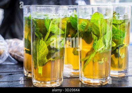 Glasses of mint tea with fresh leaves Stock Photo