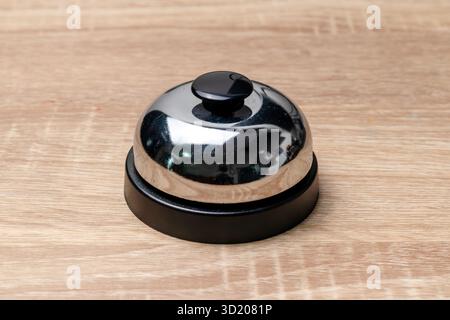 A service bell or call bell on the wooden desk Stock Photo