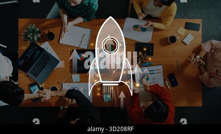 Dynamic business meeting scene featuring diverse professionals collaborating. The launch concept symbolizes growth and innovation with a focus on stra Stock Photo