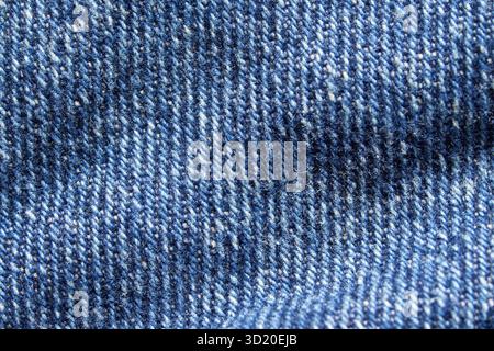 Close-up of blue denim fabric texture with detailed weave pattern and stitching Stock Photo
