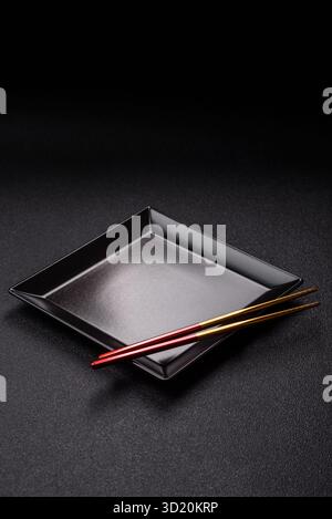 An empty plate with chopsticks for Japanese or Chinese food Stock Photo