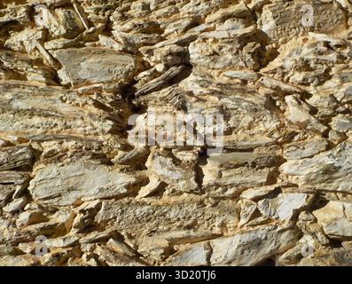 Background of flat stones forming a rustic wall Stock Photo