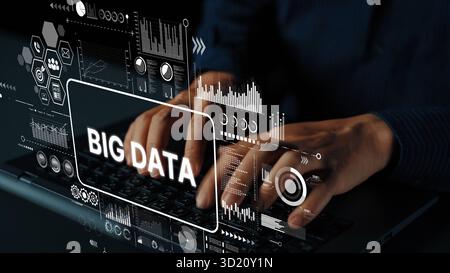 Hands Typing on Laptop with Big Data Graphics Displayed on Screen Representing Modern Technology and Data Analysis Concepts. Asymptotic smart data ana Stock Photo