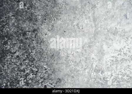 Abstract textured surface with black and white gradients in a rough concrete Stock Photo