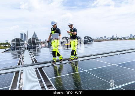 Professional Engineer Service Solar Panel. Worker Maintenance Cleaning Replacing Solar Panel. Solar photovoltaic panel system in Industry roof. Saving Stock Photo