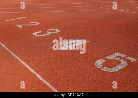 Running track with line of start position number counting, business position concept Stock Photo