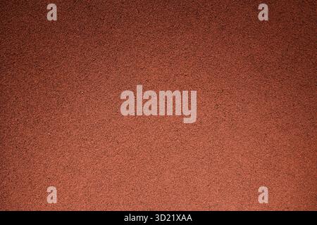 Synthetic running track, rough rugged rubber floor pattern texture for background Stock Photo
