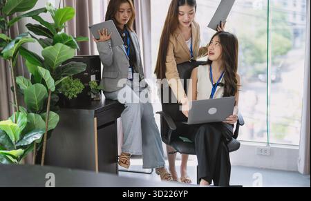 Group of business people collaborating new project in office asian business woman team meeting discuss ideas Three female entrep Stock Photo