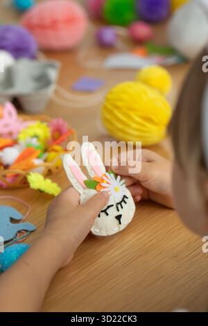 Creative Easter crafts with homemade decorations for children's entertainment. Easter bunny. DIY Stock Photo