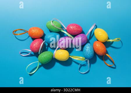 Collection of decorative and colorful Easter eggs on a blue background. Easter card. Stock Photo