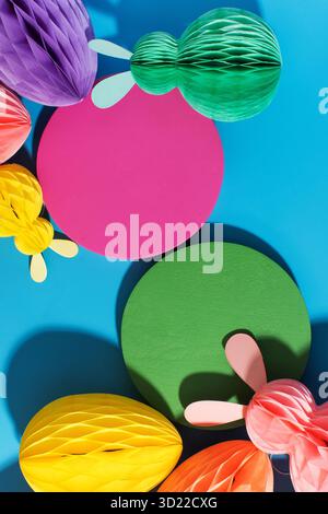 Colorful Easter decorations with paper Easter eggs with space for text. Easter invitation card. Stock Photo