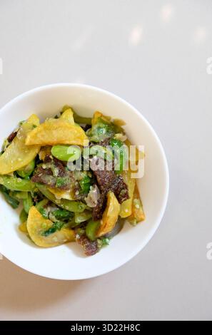 Rinuak fish jerky (endemic fish from Maninjau Lake) cooked with green chili sauce, stinky beans and potatoes Stock Photo