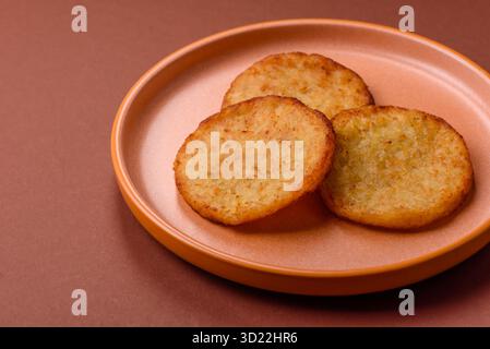 Hash browns, a breakfast food made of potatoes, onions and vegetables. Hash browns with potatoes Stock Photo