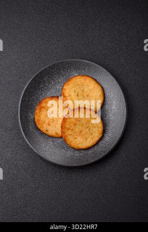 Hash browns, a breakfast food made of potatoes, onions and vegetables. Hash browns with potatoes Stock Photo