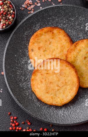 Hash browns, a breakfast food made of potatoes, onions and vegetables. Hash browns with potatoes Stock Photo