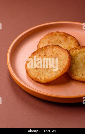 Hash browns, a breakfast food made of potatoes, onions and vegetables. Hash browns with potatoes Stock Photo