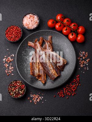 Dried salted fish as snacks or jerky, seafood as slices. Dried seafood snacks Stock Photo