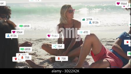 Smiling woman wearing red sunglasses and swimsuit sitting on sandy beach, with social media icons Stock Photo