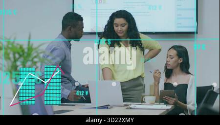 Analyzing charts three professionals in suits reviewing in meeting room with laptop and tablet Stock Photo