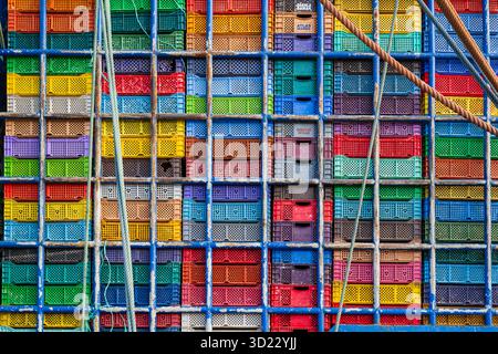 Colorful stacks of plastic crates arranged in a grid pattern.  Essaouira, Morocco Stock Photo
