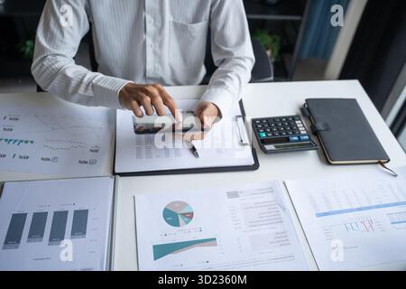 Male Professional Working on Digital Tablet in Office Stock Photo