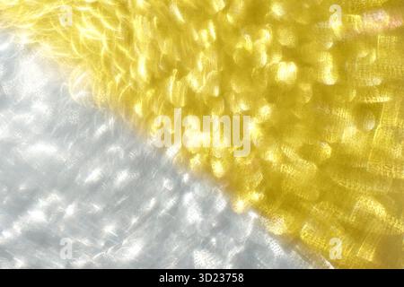 Abstract yellow and white light patterns with a playful swirl effect and vivid Stock Photo