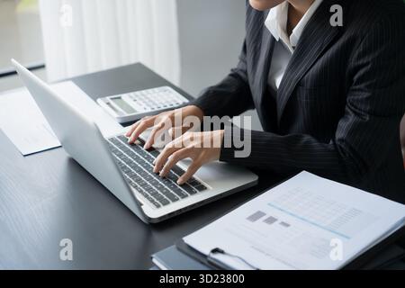Business man Auditor or internal revenue service staff checking annual financial statements company Audit  Accounting tax Stock Photo