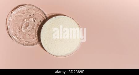 Samples of collagen powder and hyaluronic acid in Petri dishes on a pink background close-up view from above. Copy space Stock Photo
