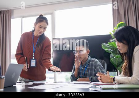 Asian business woman Application Designers presenting trending products report mobile application planning process development s Stock Photo