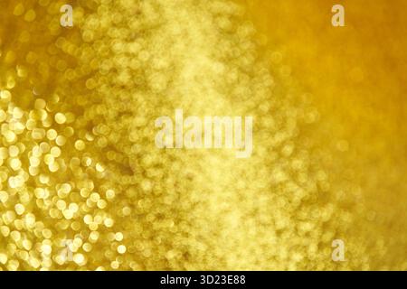 Abstract golden bokeh background with soft blurred light sparkles and glittering Stock Photo