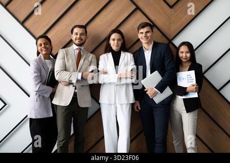 Happy multicultural staff corporate employees people looking at camera, team portrait Stock Photo