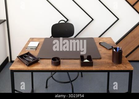 Desktop made of wood of the head of the company in the office Stock Photo