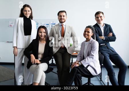Fun group of young employees in the workplace Stock Photo
