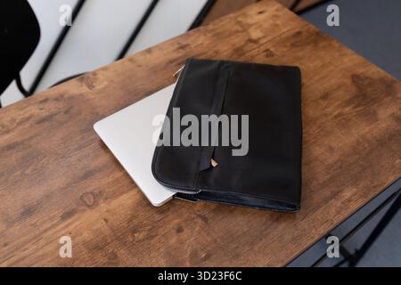 Leather folder laptop case on the table Stock Photo