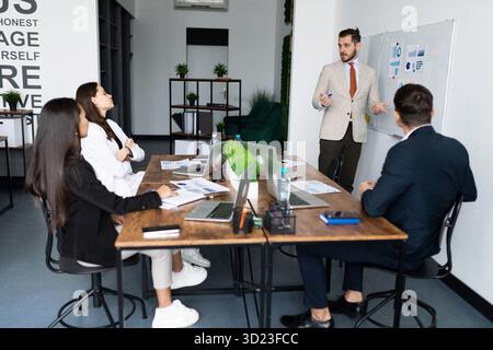 Important negotiations in the office at the table with businessmen with laptops Stock Photo